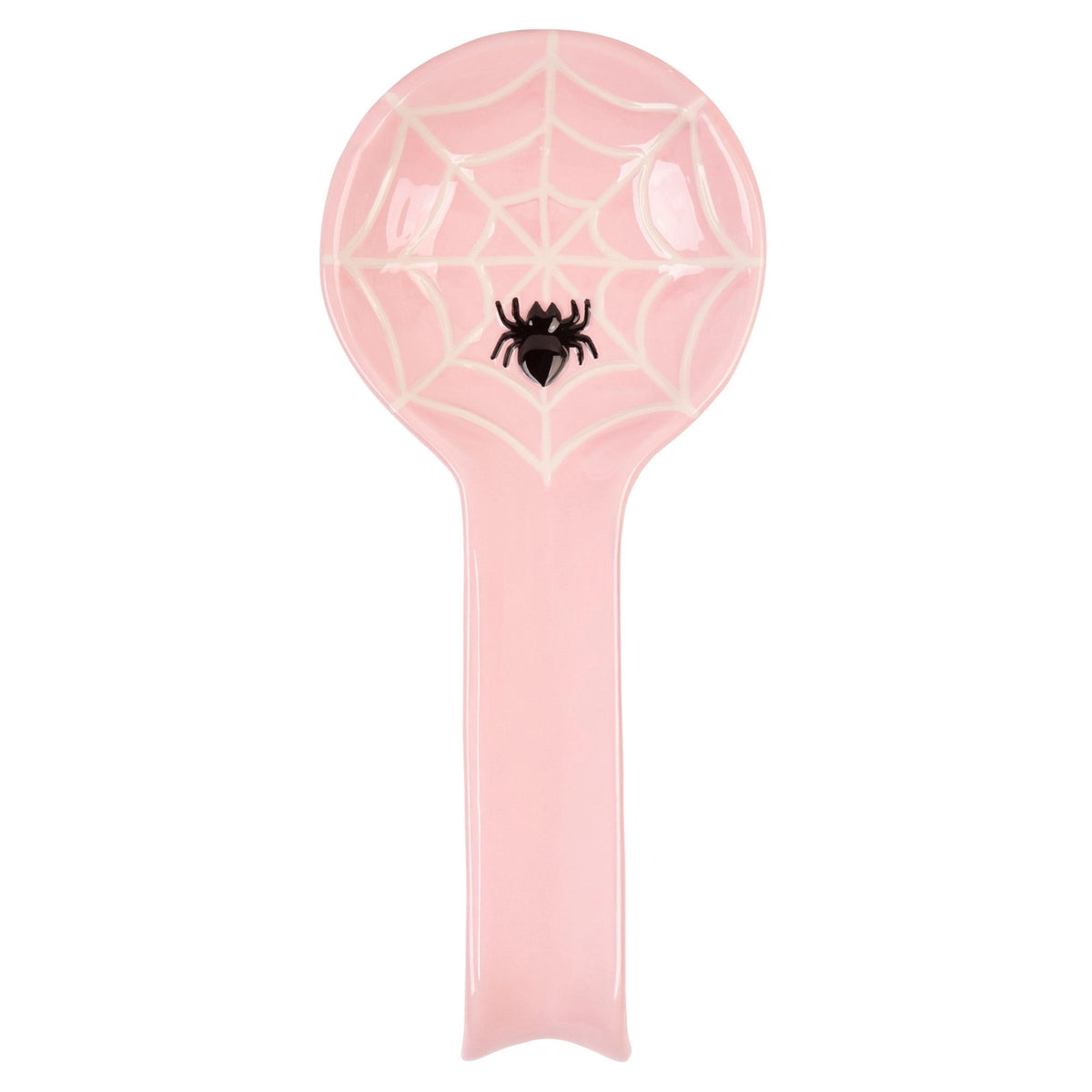 Overhead view of a pink spoon rest with a long handle, raised cream spiderweb and black spider on white.